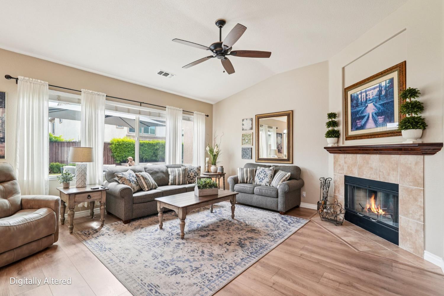 164 Legacy Street Manteca, CA 95337 - Photo 6 of 33 a living room with furniture and a fireplace