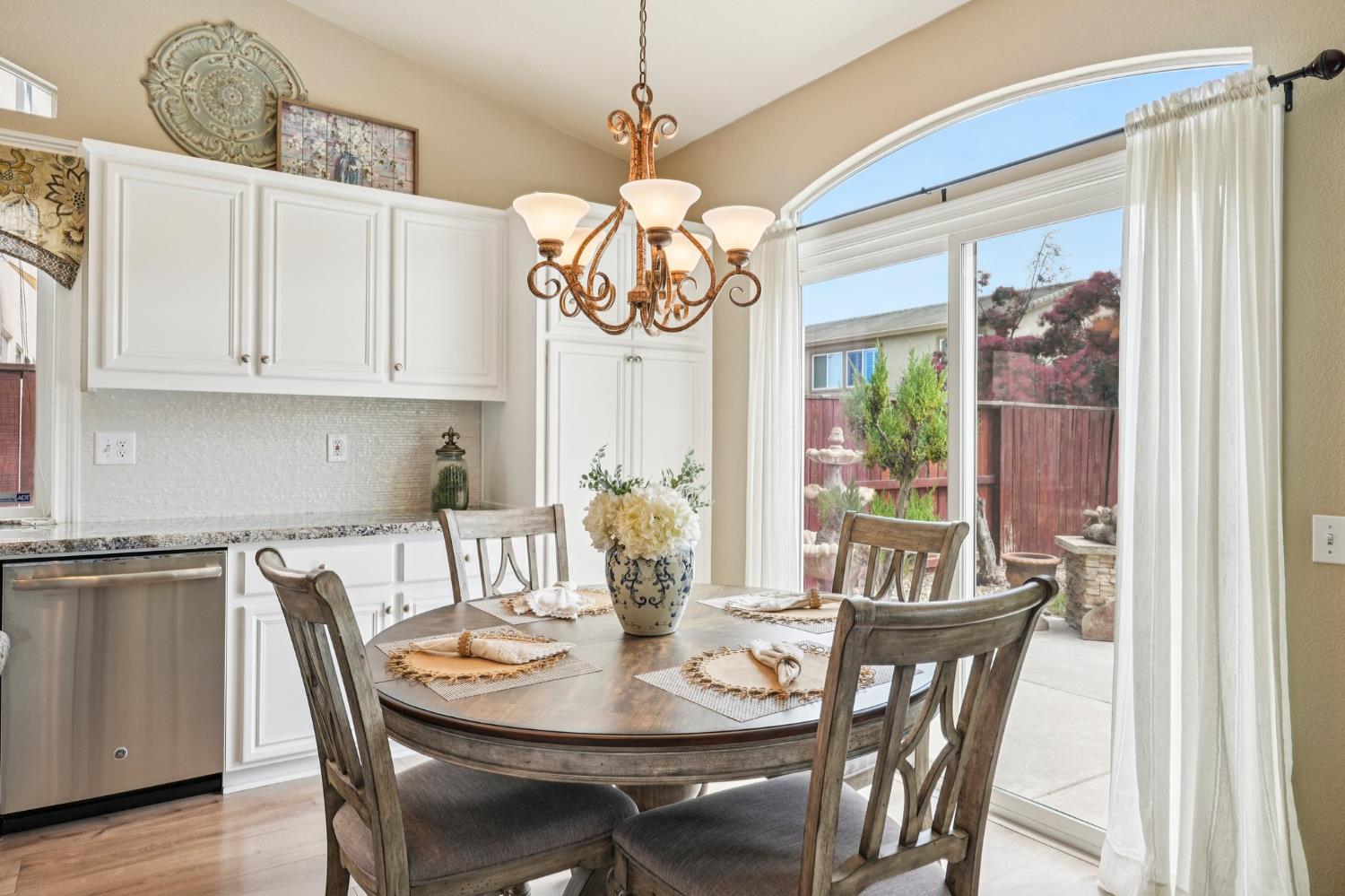 164 Legacy Street Manteca, CA 95337 - Photo 10 of 33 a view of a dining room with furniture window and outside view