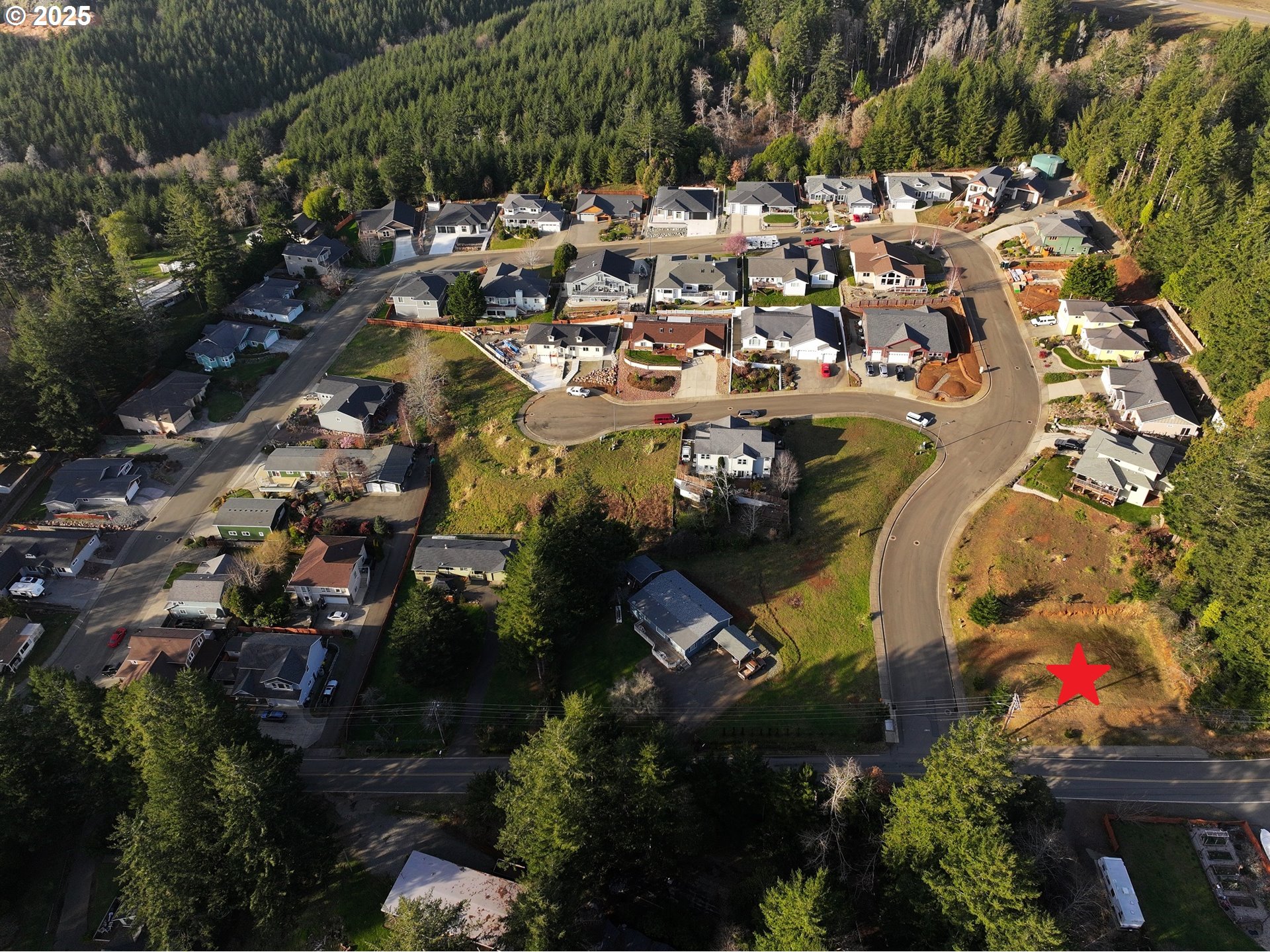 an aerial view of a house with a swimming pool and outdoor seating