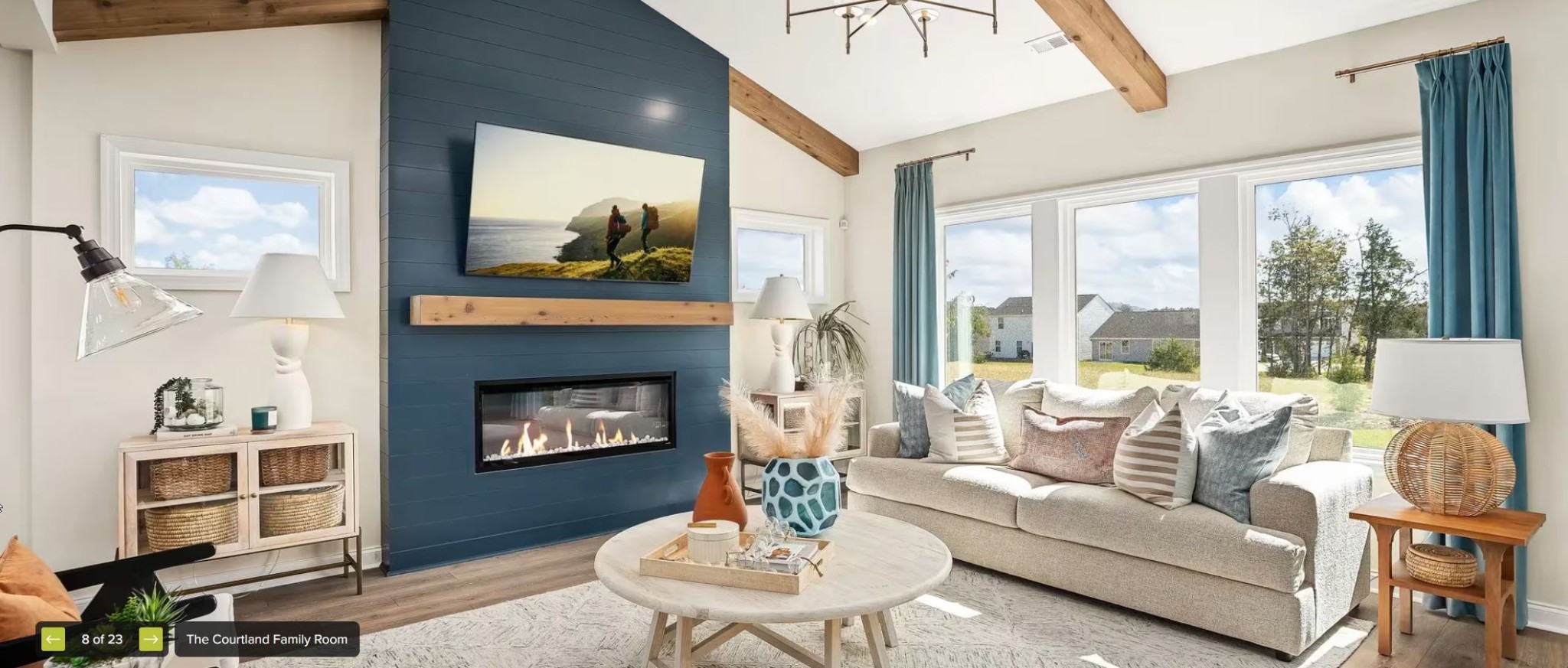 598 Baker Road Columbia, TN 38401 - Photo 6 of 9 a living room with furniture a fireplace and a large window with balcony view