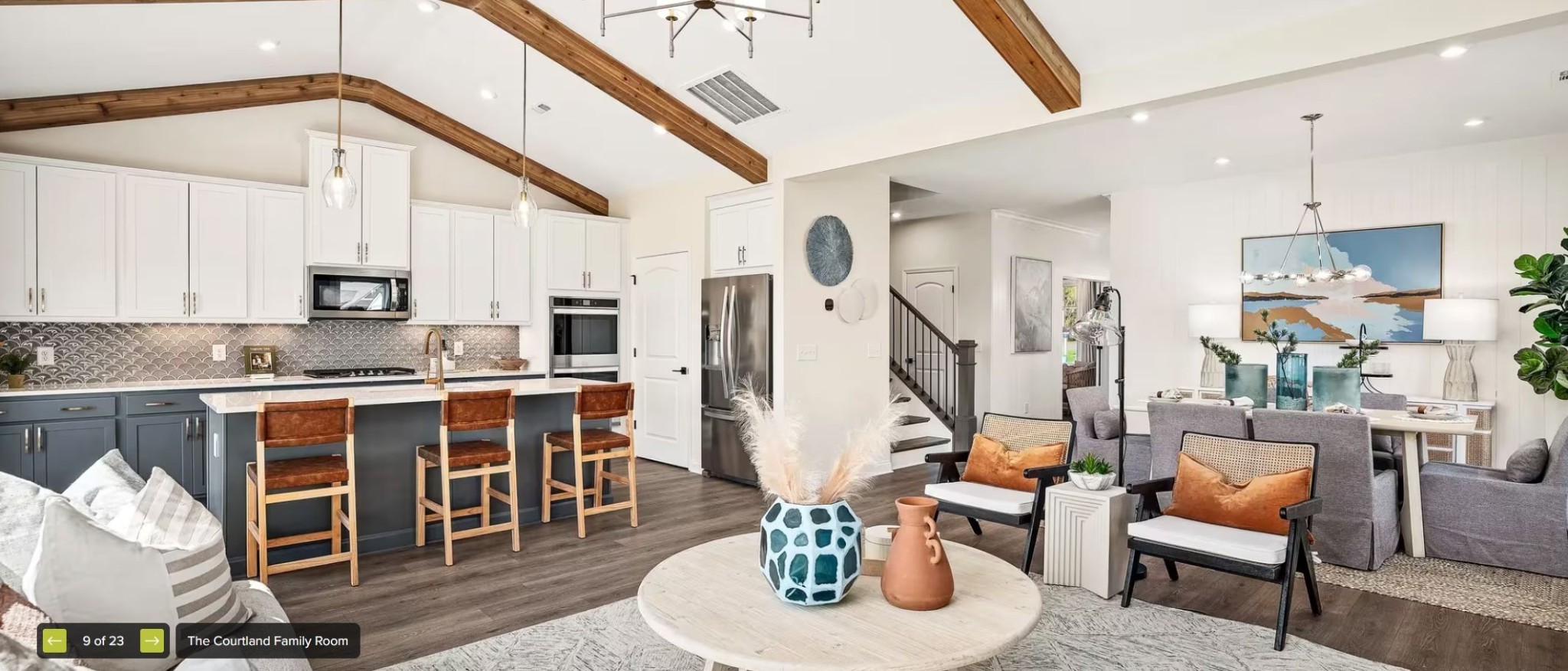 598 Baker Road Columbia, TN 38401 - Photo 7 of 9 a kitchen with stainless steel appliances kitchen island granite countertop a table chairs in it and white cabinets