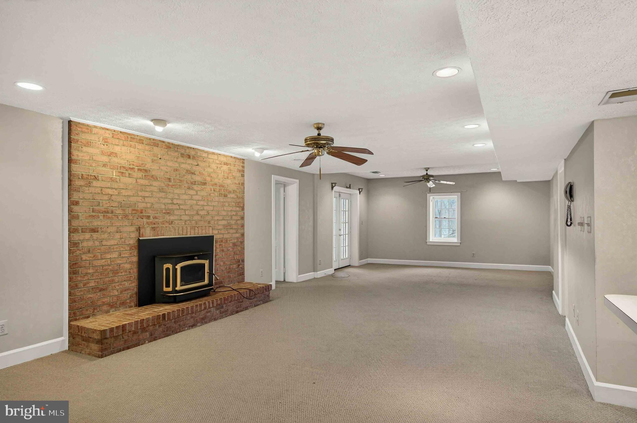 6612 Colchester Road Clifton, VA 20124 - Photo 68 of 93 Large living area with wood stove fireplace