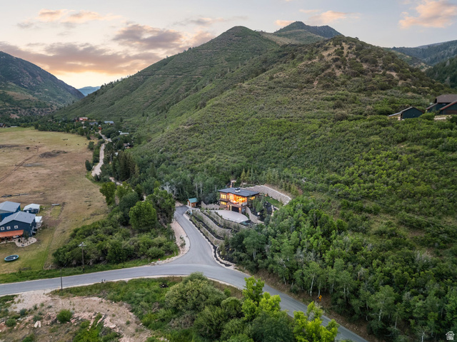 1400 Weber Wild Road Oakley, UT 84055 - Photo 55 of 55 Contemporary residence nestled into a verdant hillside, featuring multiple levels of stone retaining walls