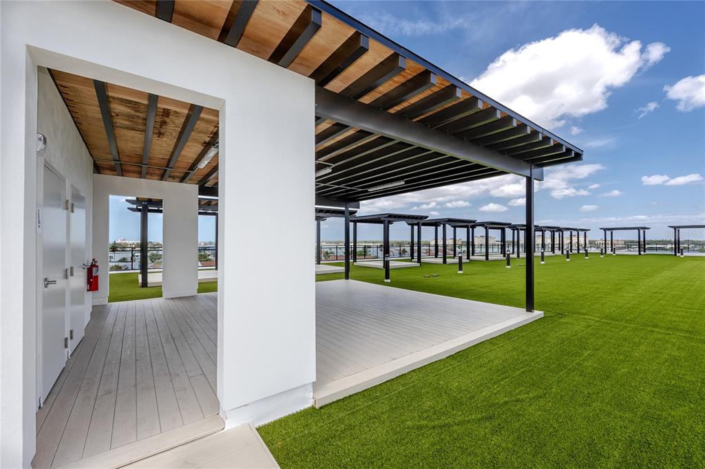 400 150th Avenue, Unit 501 Madeira Beach, FL 33708 - Photo 14 of 76 a view of an house with backyard space and porch
