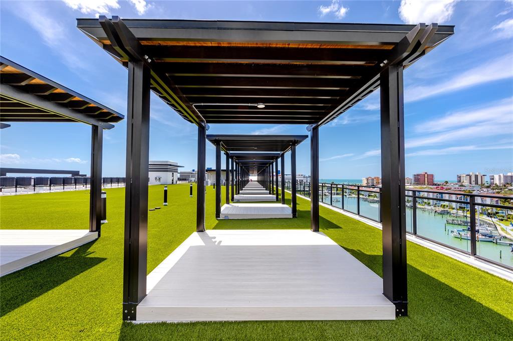 400 150th Avenue, Unit 501 Madeira Beach, FL 33708 - Photo 17 of 76 a view of swimming pool with seating area