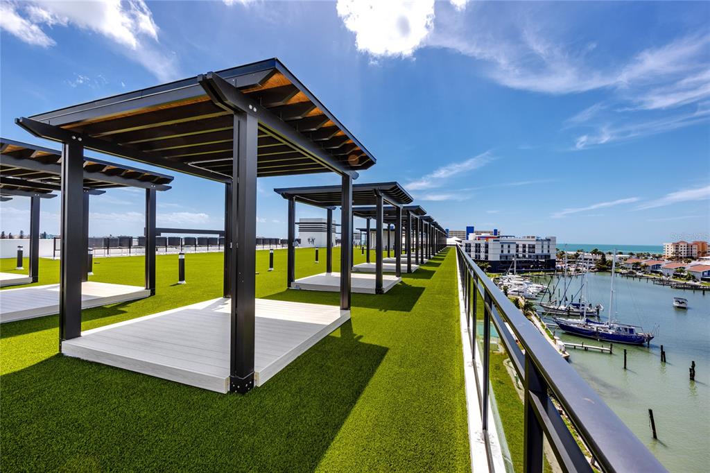 400 150th Avenue, Unit 501 Madeira Beach, FL 33708 - Photo 18 of 76 a view of a swimming pool with a deck and a patio