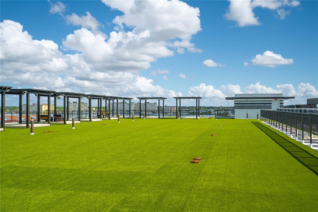 400 150th Avenue, Unit 501 Madeira Beach, FL 33708 - Photo 19 of 76 a view of swimming pool with outdoor seating