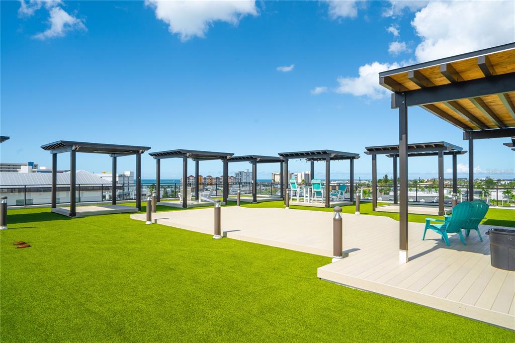 400 150th Avenue, Unit 501 Madeira Beach, FL 33708 - Photo 20 of 76 a view of a swimming pool with a garden