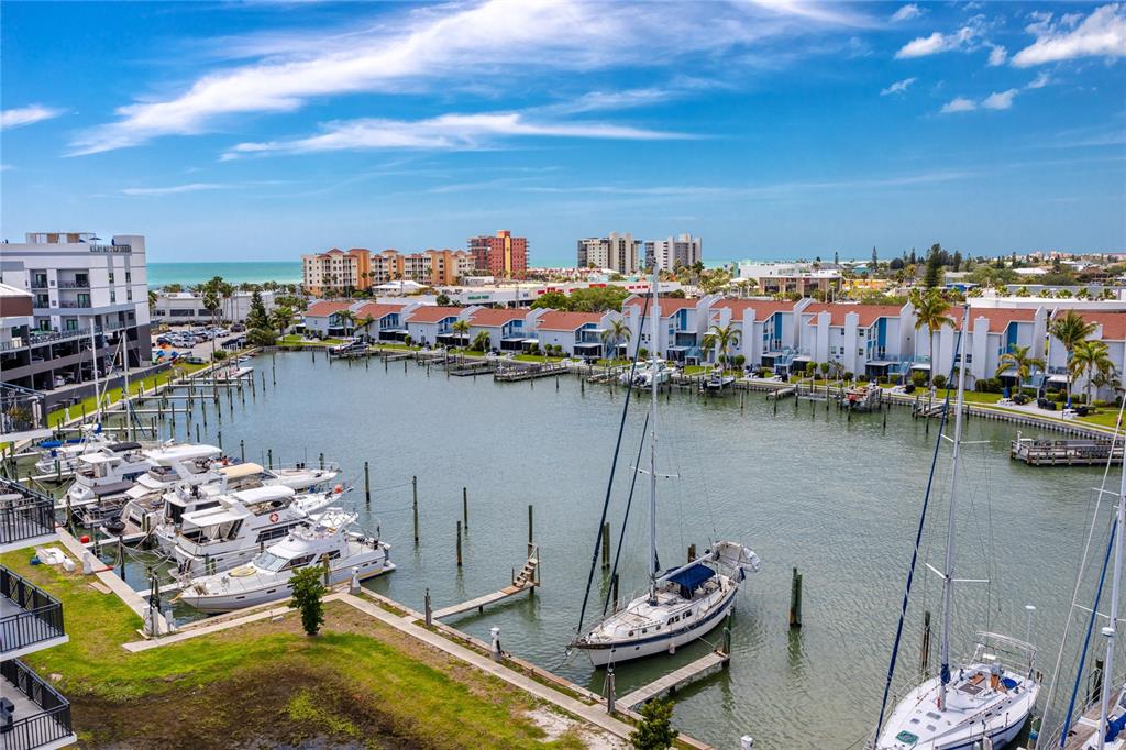 400 150th Avenue, Unit 501 Madeira Beach, FL 33708 - Photo 25 of 76 a view of a lake with a table and chairs