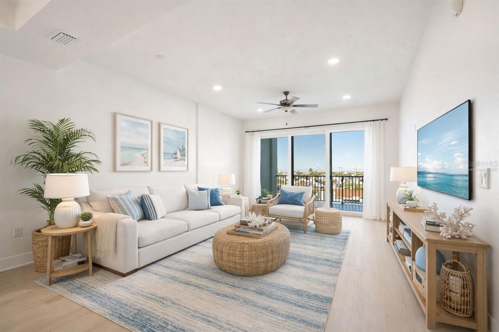 400 150th Avenue, Unit 501 Madeira Beach, FL 33708 - Photo 30 of 76 a living room with furniture and a flat screen tv