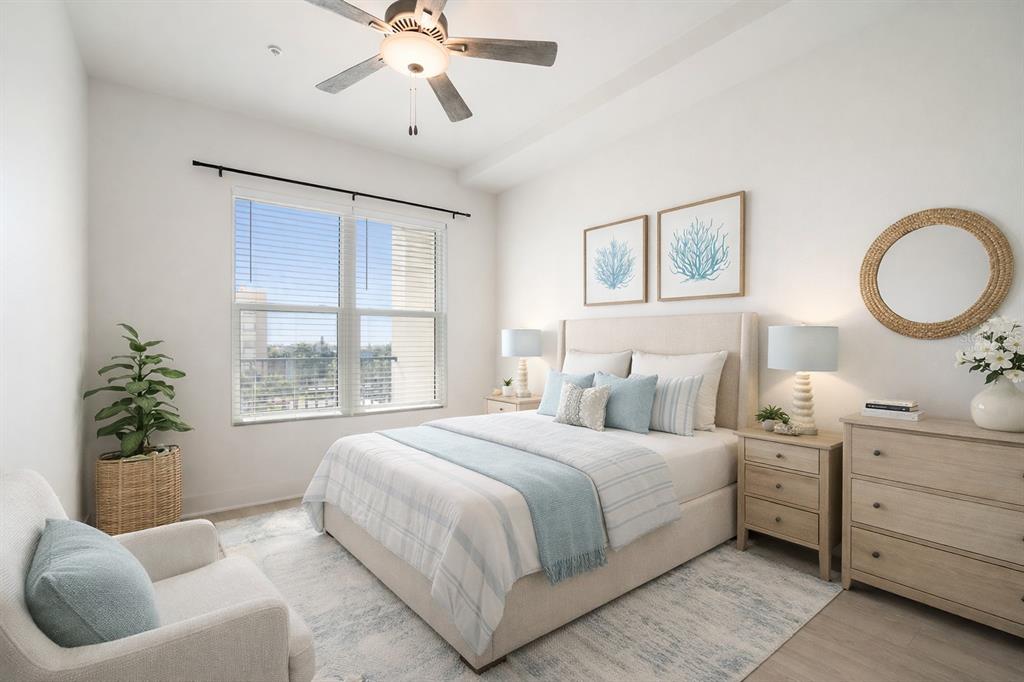 400 150th Avenue, Unit 501 Madeira Beach, FL 33708 - Photo 35 of 76 a bedroom with a large bed and a window