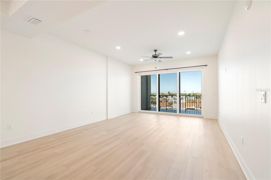 400 150th Avenue, Unit 501 Madeira Beach, FL 33708 - Photo 54 of 76 a view of an empty room with wooden floor