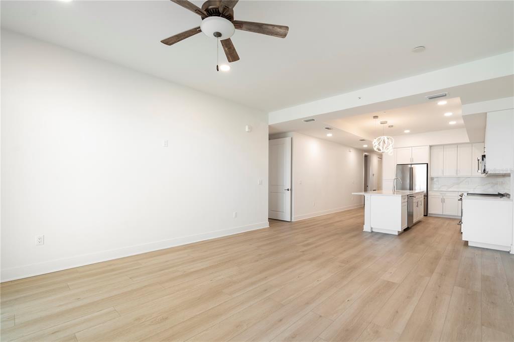 400 150th Avenue, Unit 501 Madeira Beach, FL 33708 - Photo 55 of 76 a view of an empty room and kitchen view