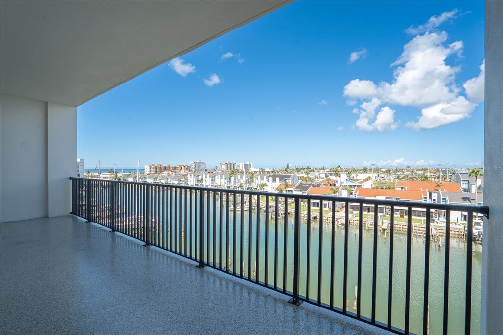 400 150th Avenue, Unit 501 Madeira Beach, FL 33708 - Photo 60 of 76 a view of a balcony with wooden floor