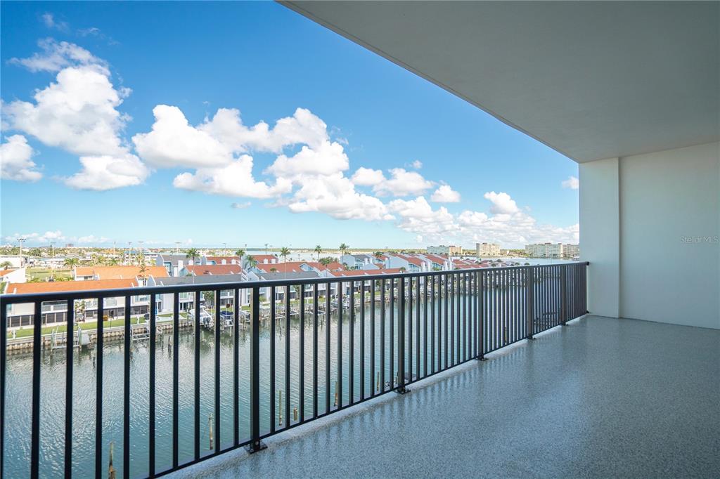 400 150th Avenue, Unit 501 Madeira Beach, FL 33708 - Photo 64 of 76 a view of a balcony with wooden floor