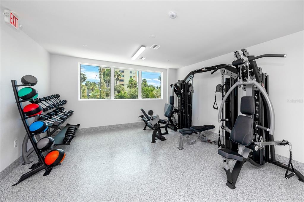 400 150th Avenue, Unit 501 Madeira Beach, FL 33708 - Photo 65 of 76 a view of a room with gym equipment