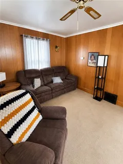 a living room with a couch and a window