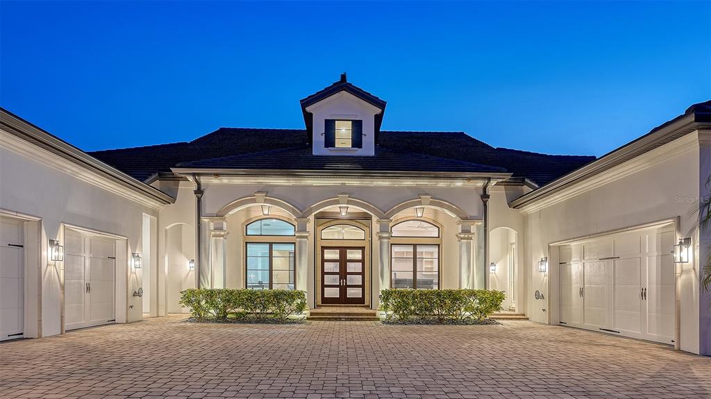 313 Lookout Point Drive Osprey, FL 34229 - Photo 16 of 100 a front view of a house with garden
