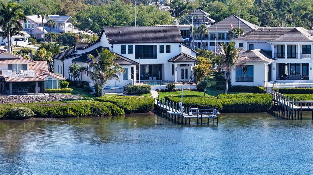 313 Lookout Point Drive Osprey, FL 34229 - Photo 24 of 100 a aerial view of a house with a yard table and chairs