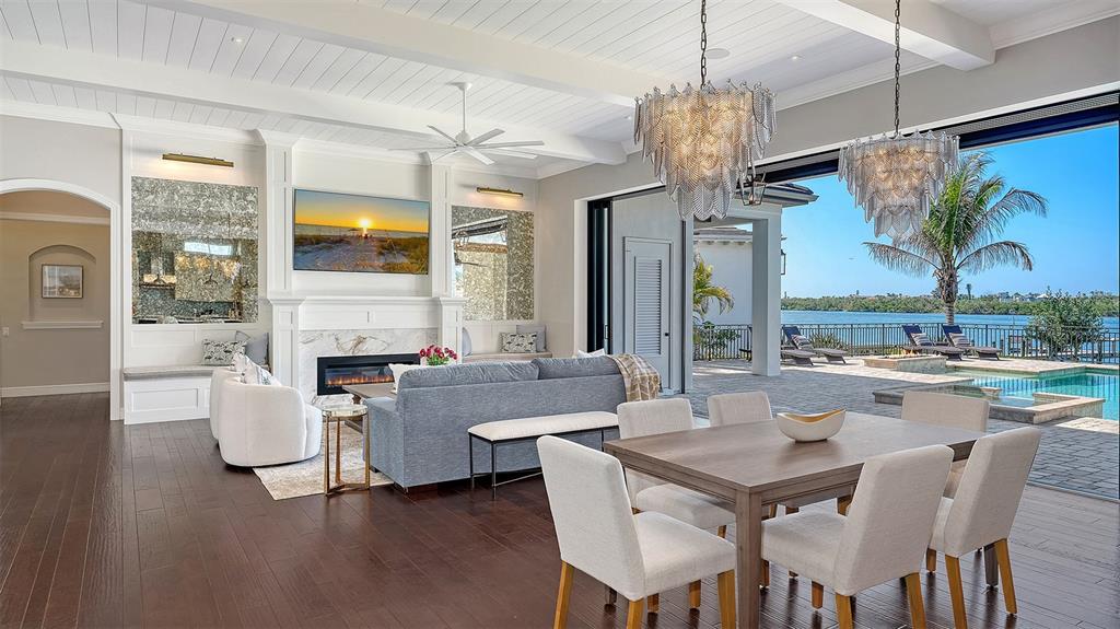 313 Lookout Point Drive Osprey, FL 34229 - Photo 39 of 100 a view of a dining room with furniture wooden floor and chandelier