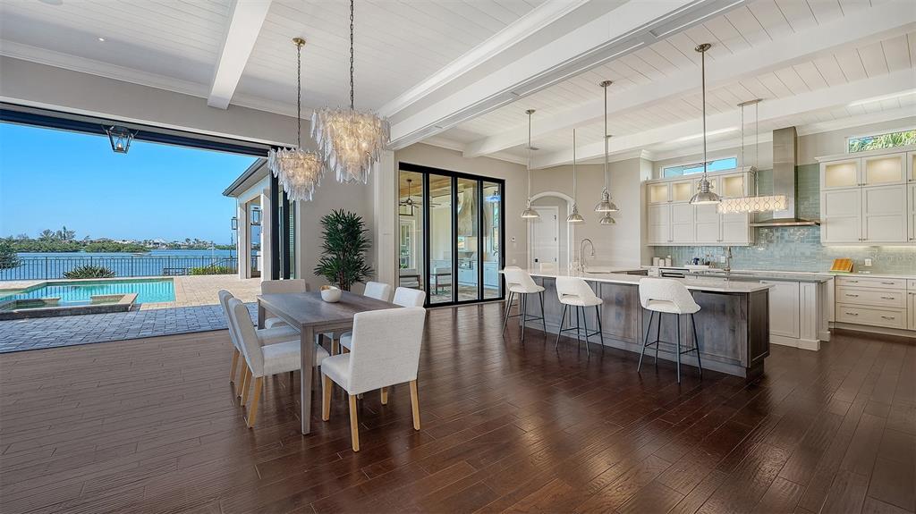 313 Lookout Point Drive Osprey, FL 34229 - Photo 40 of 100 a view of a dining room with furniture window and wooden floor