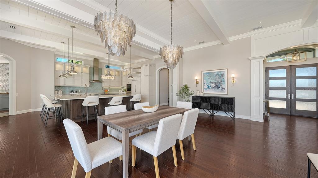 313 Lookout Point Drive Osprey, FL 34229 - Photo 42 of 100 a view of a dining room with furniture and wooden floor