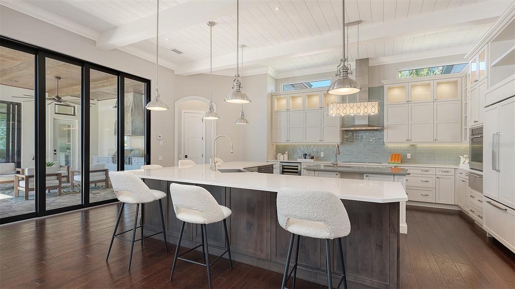 313 Lookout Point Drive Osprey, FL 34229 - Photo 43 of 100 a large kitchen with a table and chairs