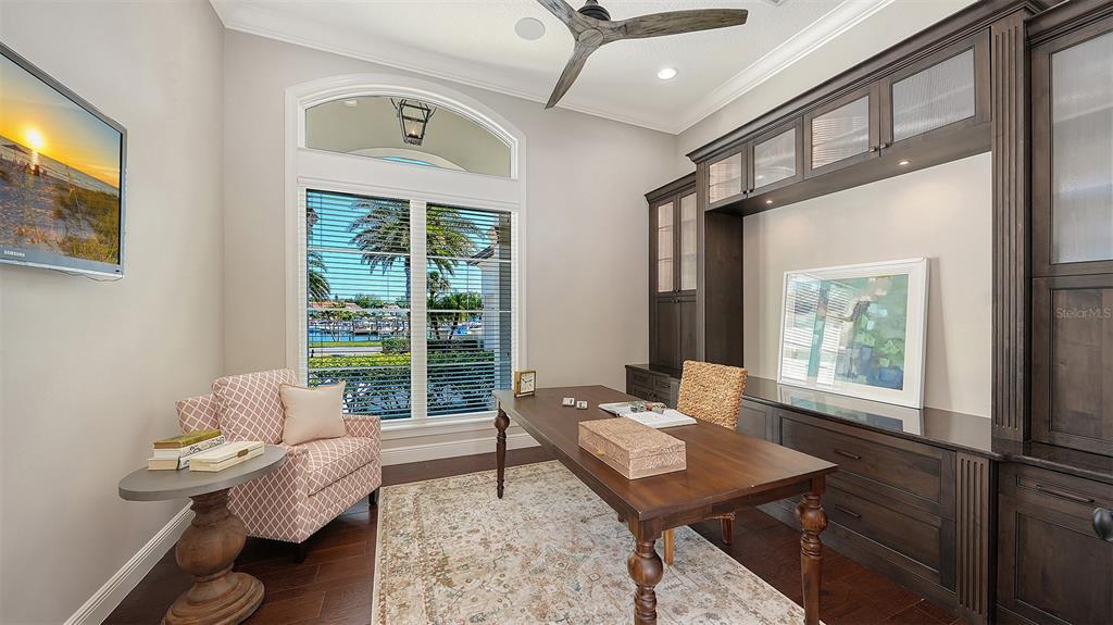 313 Lookout Point Drive Osprey, FL 34229 - Photo 52 of 100 a living room with furniture and a window