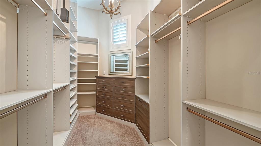 313 Lookout Point Drive Osprey, FL 34229 - Photo 58 of 100 a view of walk in closet with empty racks