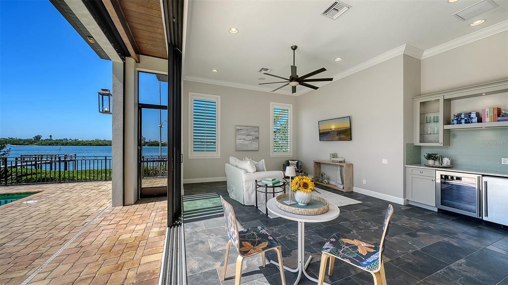 313 Lookout Point Drive Osprey, FL 34229 - Photo 65 of 100 a view of a dining room with furniture window and wooden floor