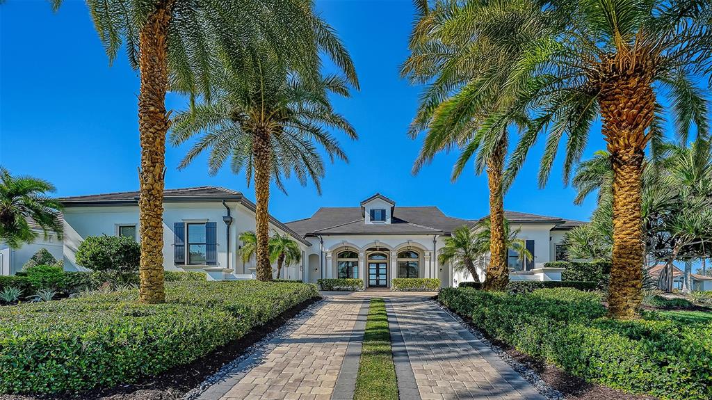 313 Lookout Point Drive Osprey, FL 34229 - Photo 7 of 100 a front view of a house with yard and hallway