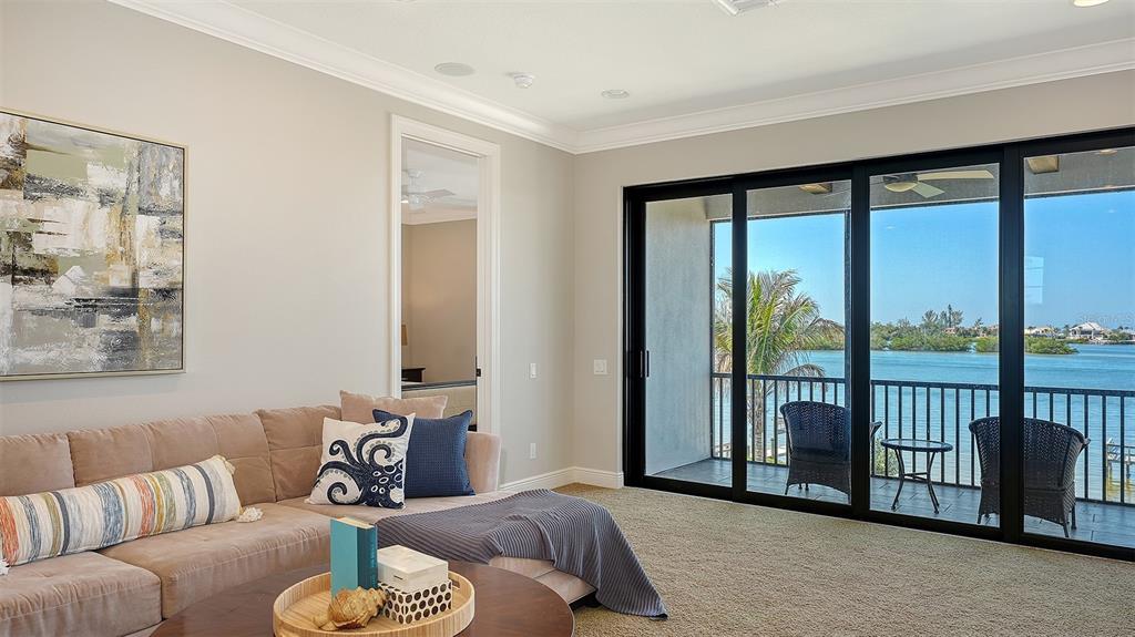 313 Lookout Point Drive Osprey, FL 34229 - Photo 77 of 100 a living room with furniture and a large window