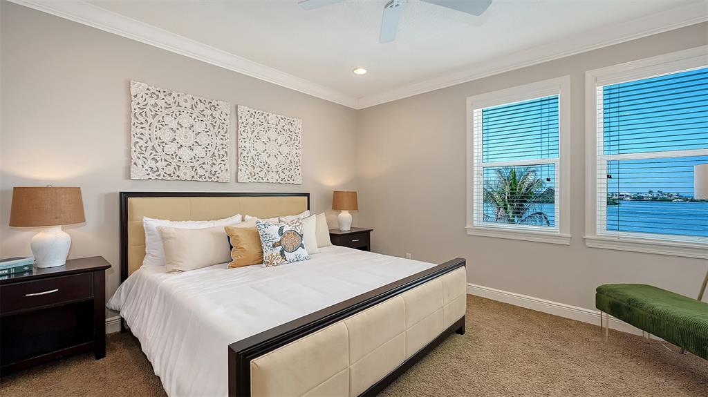 313 Lookout Point Drive Osprey, FL 34229 - Photo 80 of 100 a bedroom with a bed and a window