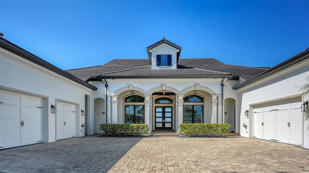 313 Lookout Point Drive Osprey, FL 34229 - Photo 8 of 100 a front view of a house with garden