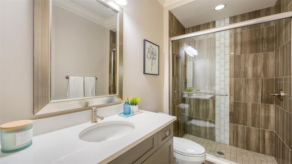 313 Lookout Point Drive Osprey, FL 34229 - Photo 86 of 100 a bathroom with a sink toilet and shower