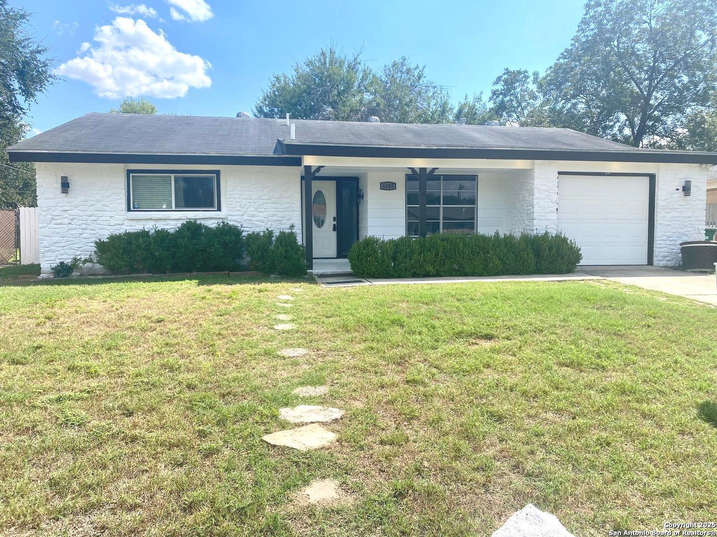 5142 Village Court San Antonio, TX 78218 - Photo 1 of 14 a view of a house with a yard and a tree