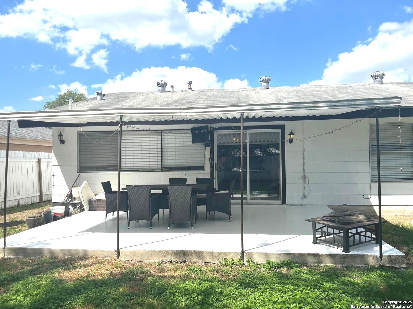 5142 Village Court San Antonio, TX 78218 - Photo 13 of 14 a view of building with table and chairs