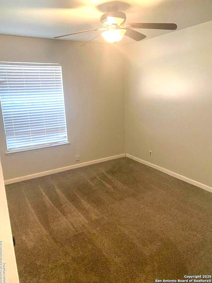 5142 Village Court San Antonio, TX 78218 - Photo 7 of 14 a view of a room that has a window in it