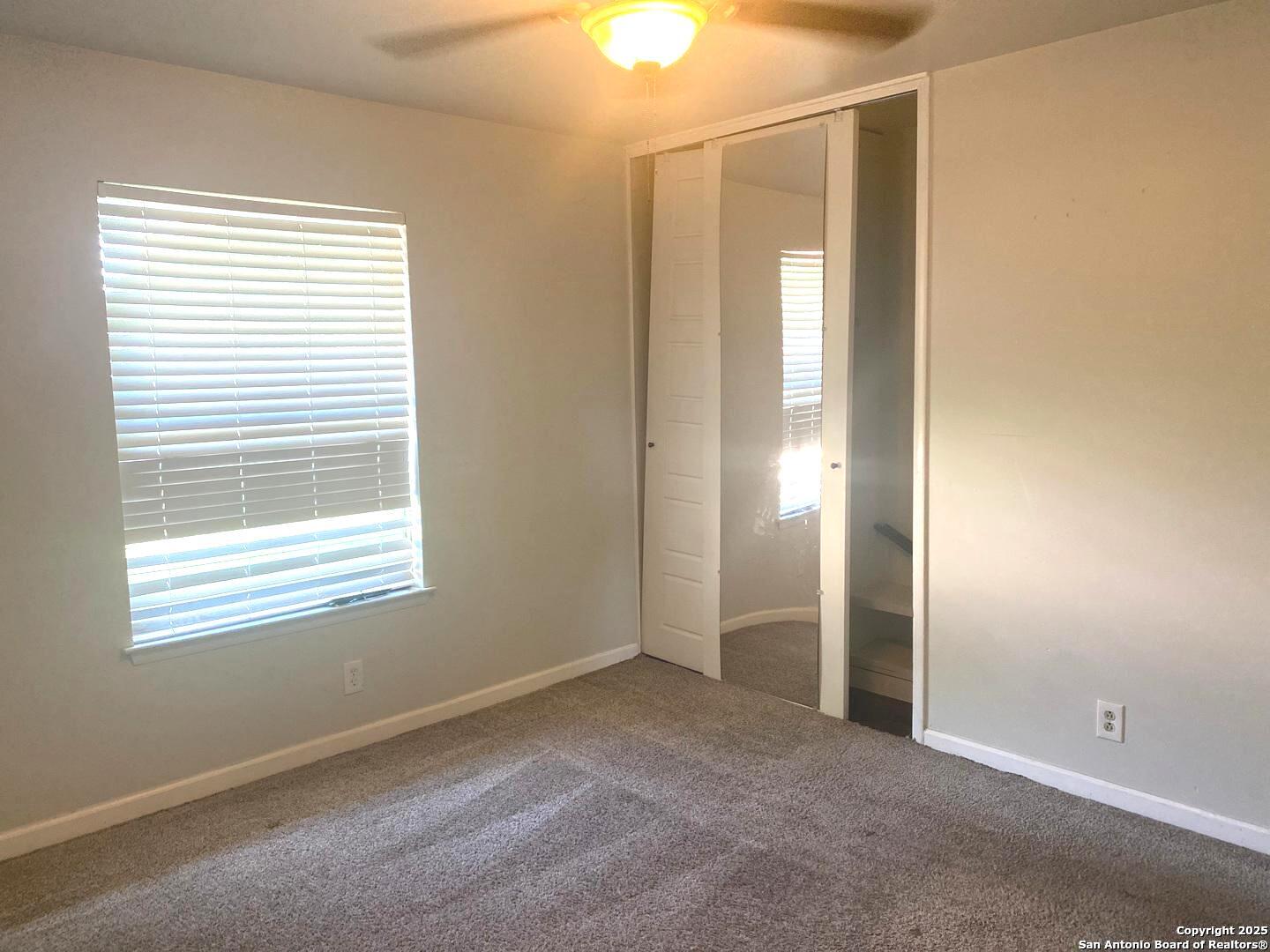 5142 Village Court San Antonio, TX 78218 - Photo 8 of 14 a view of an empty room with a window