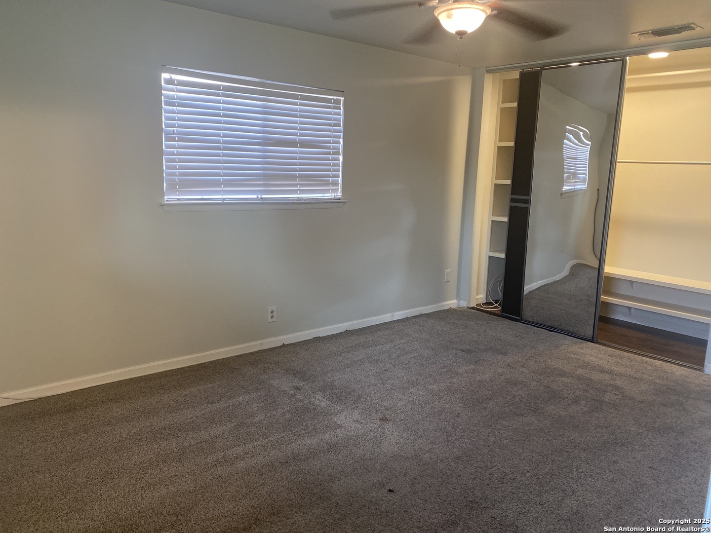 5142 Village Court San Antonio, TX 78218 - Photo 9 of 14 a view of an empty room with a window