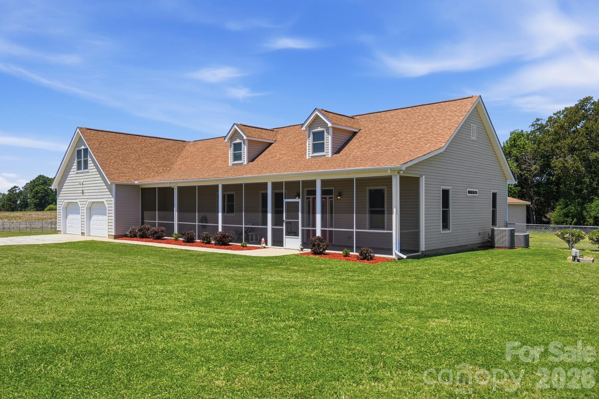 4415 Old Monroe Marshville Road Wingate, NC 28174 - Photo 3 of 28 a view of a house with a yard and sitting area