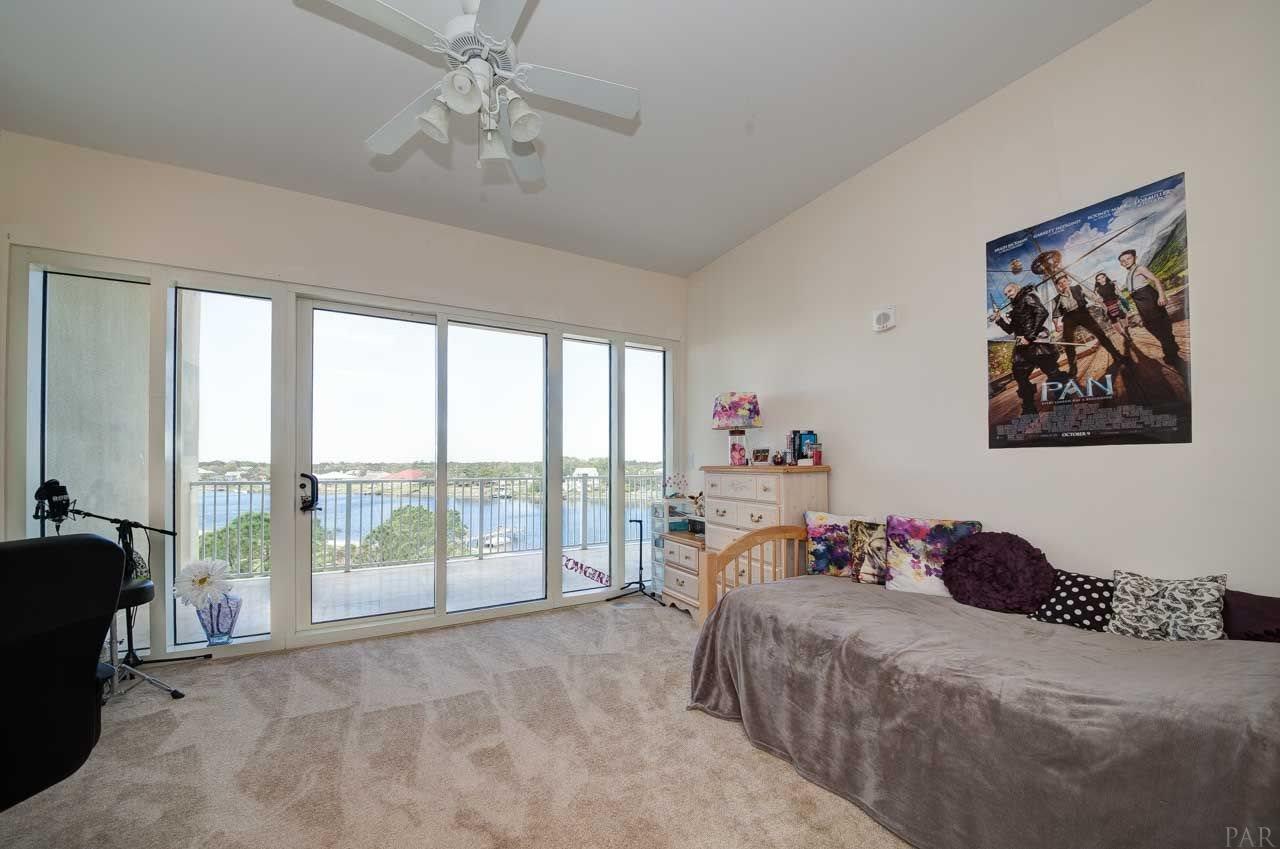 13928 River Road, Unit 504 Perdido Key, FL 32507 - Photo 22 of 40 a bedroom with a bed and a large window