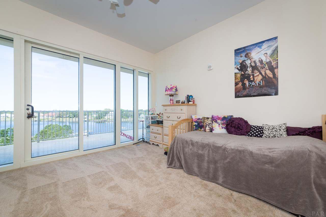13928 River Road, Unit 504 Perdido Key, FL 32507 - Photo 23 of 40 a bedroom with a bed and a large window