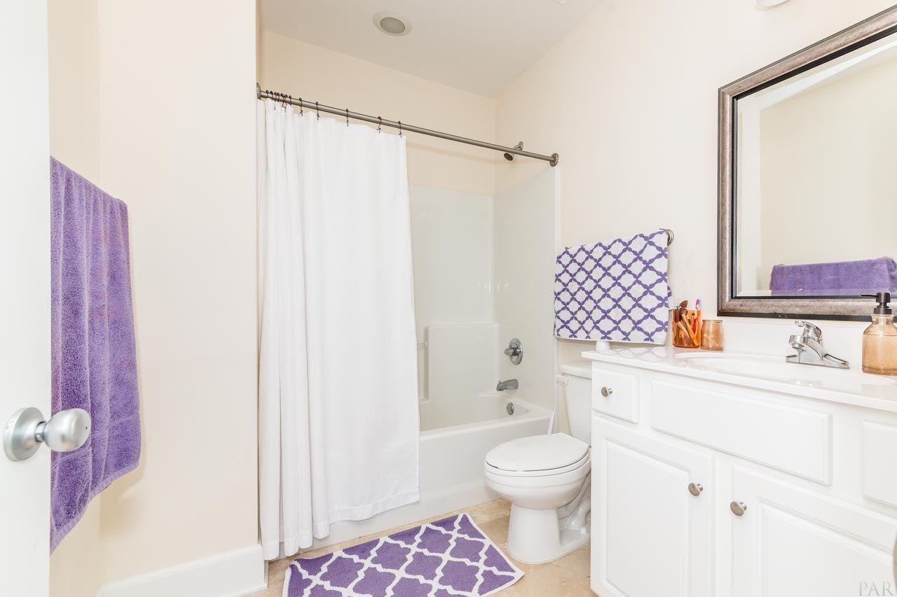 13928 River Road, Unit 504 Perdido Key, FL 32507 - Photo 24 of 40 a bathroom with a sink toilet and shower