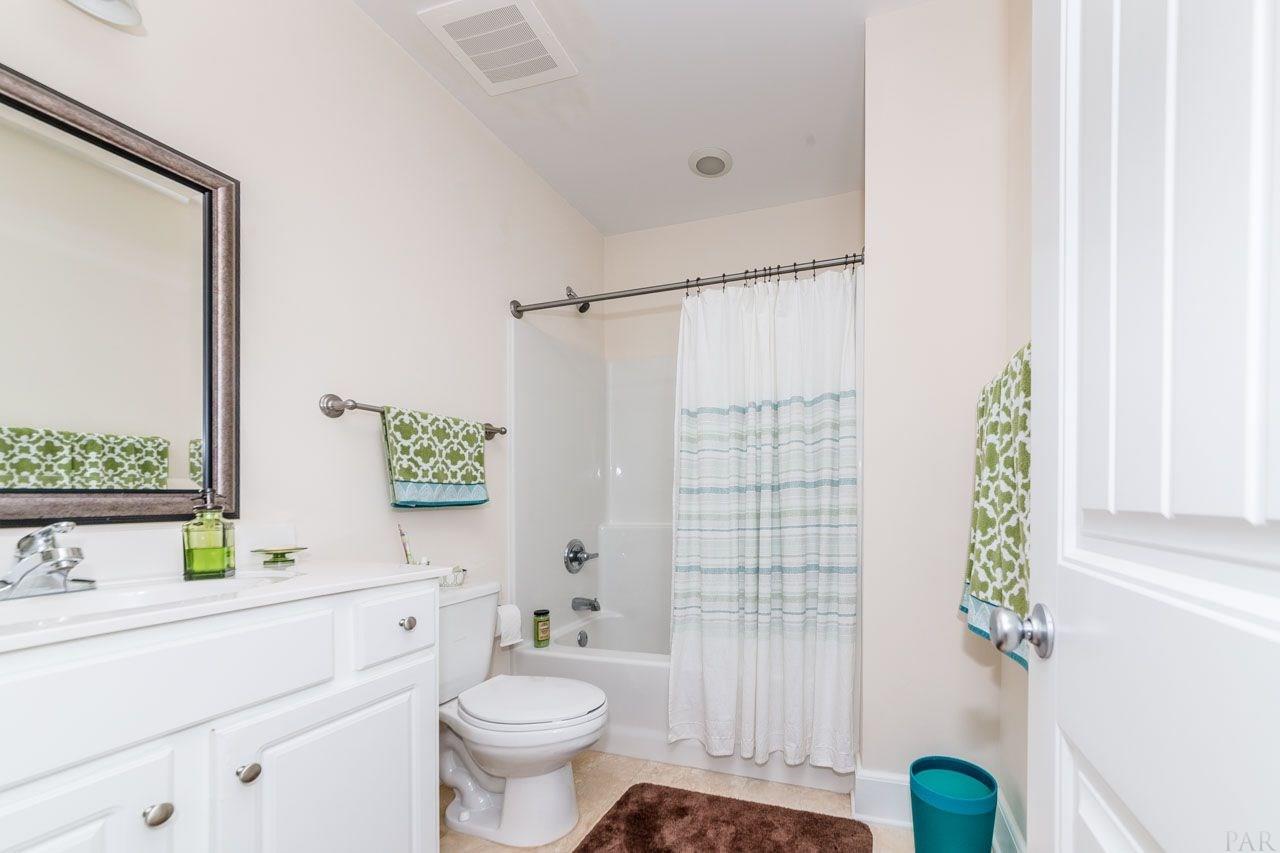 13928 River Road, Unit 504 Perdido Key, FL 32507 - Photo 26 of 40 a bathroom with a sink toilet and shower