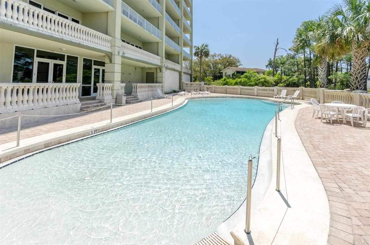 13928 River Road, Unit 504 Perdido Key, FL 32507 - Photo 32 of 40 a view of a swimming pool with a porch