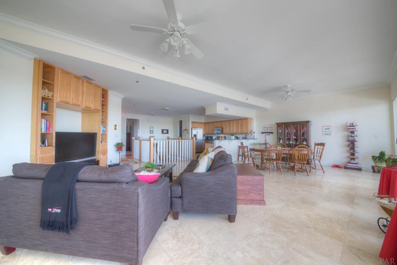 13928 River Road, Unit 504 Perdido Key, FL 32507 - Photo 6 of 40 a living room with furniture and a flat screen tv