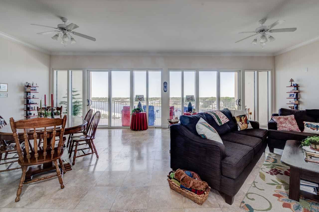 13928 River Road, Unit 504 Perdido Key, FL 32507 - Photo 9 of 40 a living room with furniture and a large window