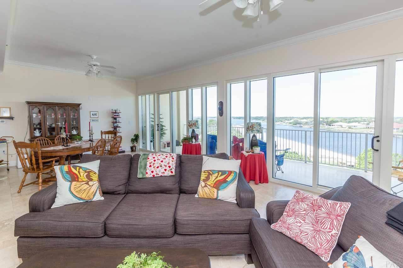 13928 River Road, Unit 504 Perdido Key, FL 32507 - Photo 10 of 40 a living room with furniture and a large window