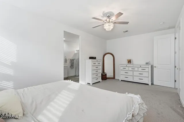 a view of a patio with a table and chairs under an umbrella with wooden floor